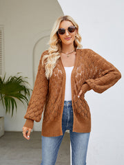 Camel open-knit balloon sleeve cardigan with textured pattern.