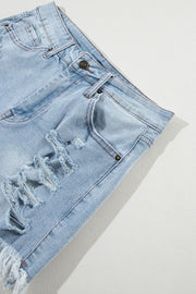 Light blue distressed denim cutoff shorts with frayed hem and ripped details.