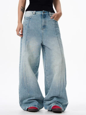 Men's light wash wide leg denim jeans with panel detailing and a relaxed fit.