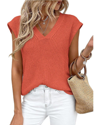 Textured V-neck sweater vest in apricot with cap sleeves.