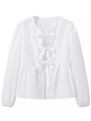 White tie-front peplum blouse with voluminous sleeves and bow details