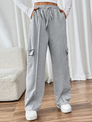 Gray cargo pocket wide leg sweatpants with drawstring waist and seam detail.