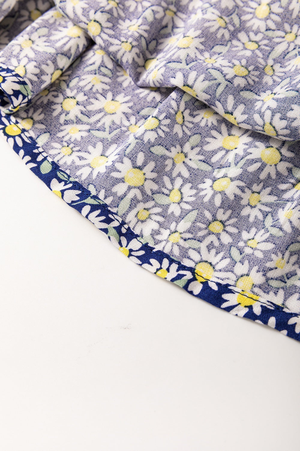 Daisy print smocked peplum blouse in dusty blue 100% viscose with contrast trim