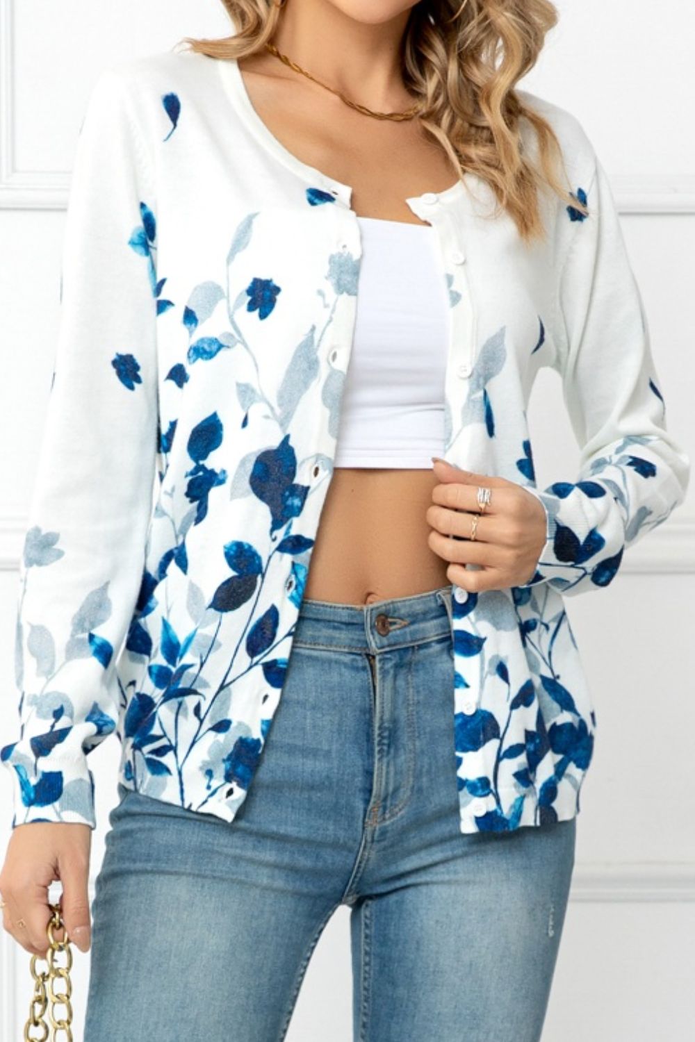 White crewneck cardigan with blue botanical print and buttons