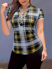 Lace-up plaid short sleeve shirt with a curved hem and a V-neckline.