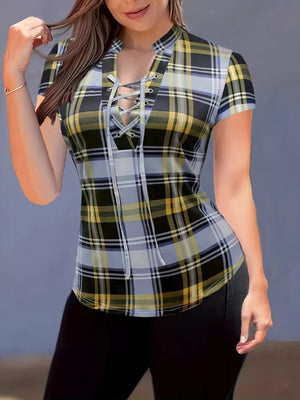Lace-up plaid short sleeve shirt with a curved hem and a V-neckline.