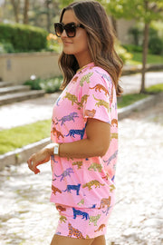 Pink leopard print loungewear set with short sleeves and shorts.