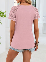 Pink waffle knit t-shirt with short lace sleeves and V-neck.