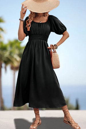 Black off-shoulder puff sleeve empire midi dress with smocked waist and A-line skirt.