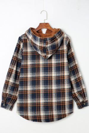 Sherpa-lined plaid overshirt jacket in navy, tan, and cream with a hood.