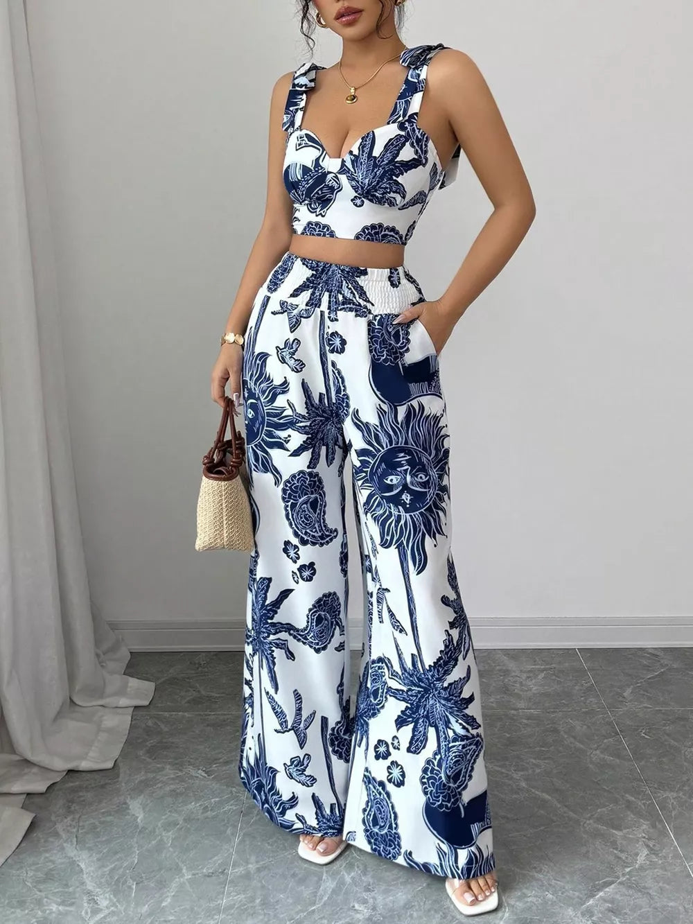 Blue and white tropical print crop top and wide-leg pants set with tie straps