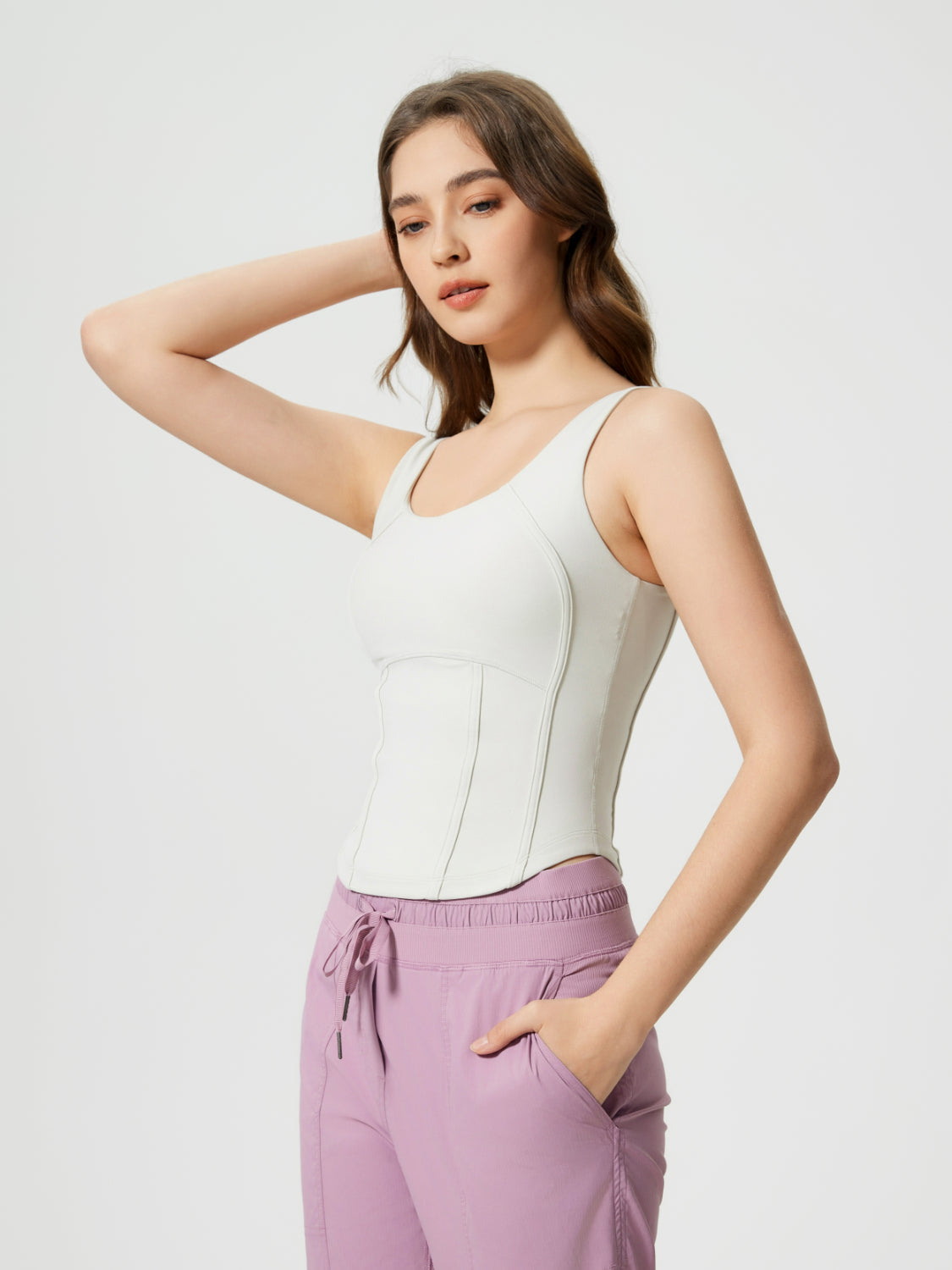 White sculpted seam tank top with built-in support and scoop neckline.