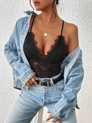 Black lace bodysuit with scalloped trim and keyhole detail, worn with jeans and denim jacket.