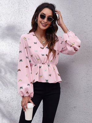 Dusty pink peplum blouse with butterfly print, V-neck, long sleeves, and gathered waist