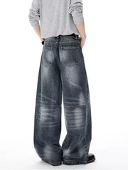 Men's dark wash wide-leg jeans with belted waist and vintage-inspired paneling.