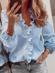 Light blue blouse with cascading ruffle front and balloon sleeves