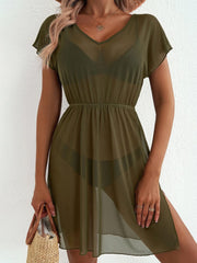 Green sheer mini dress with V-neck, short sleeves, elastic waist, and thigh slit.