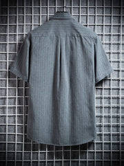 Grey pinstripe short sleeve buttoned shirt with a classic collar.