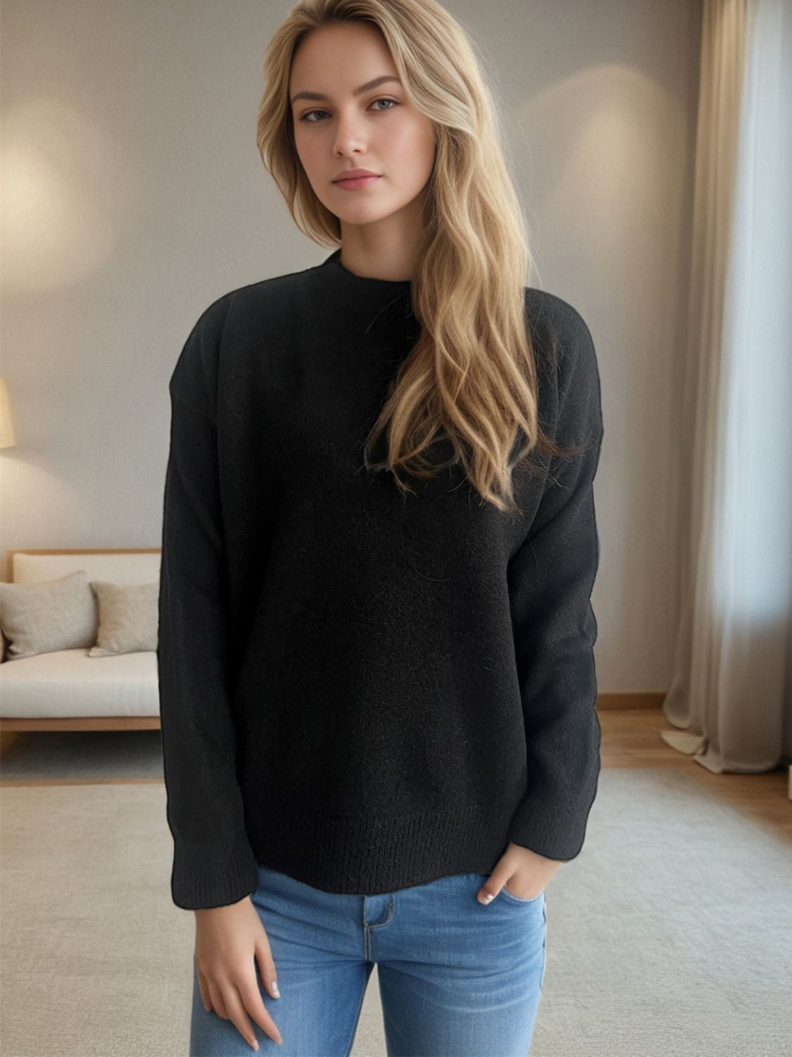 Black textured knit crew neck pullover sweater with long sleeves.