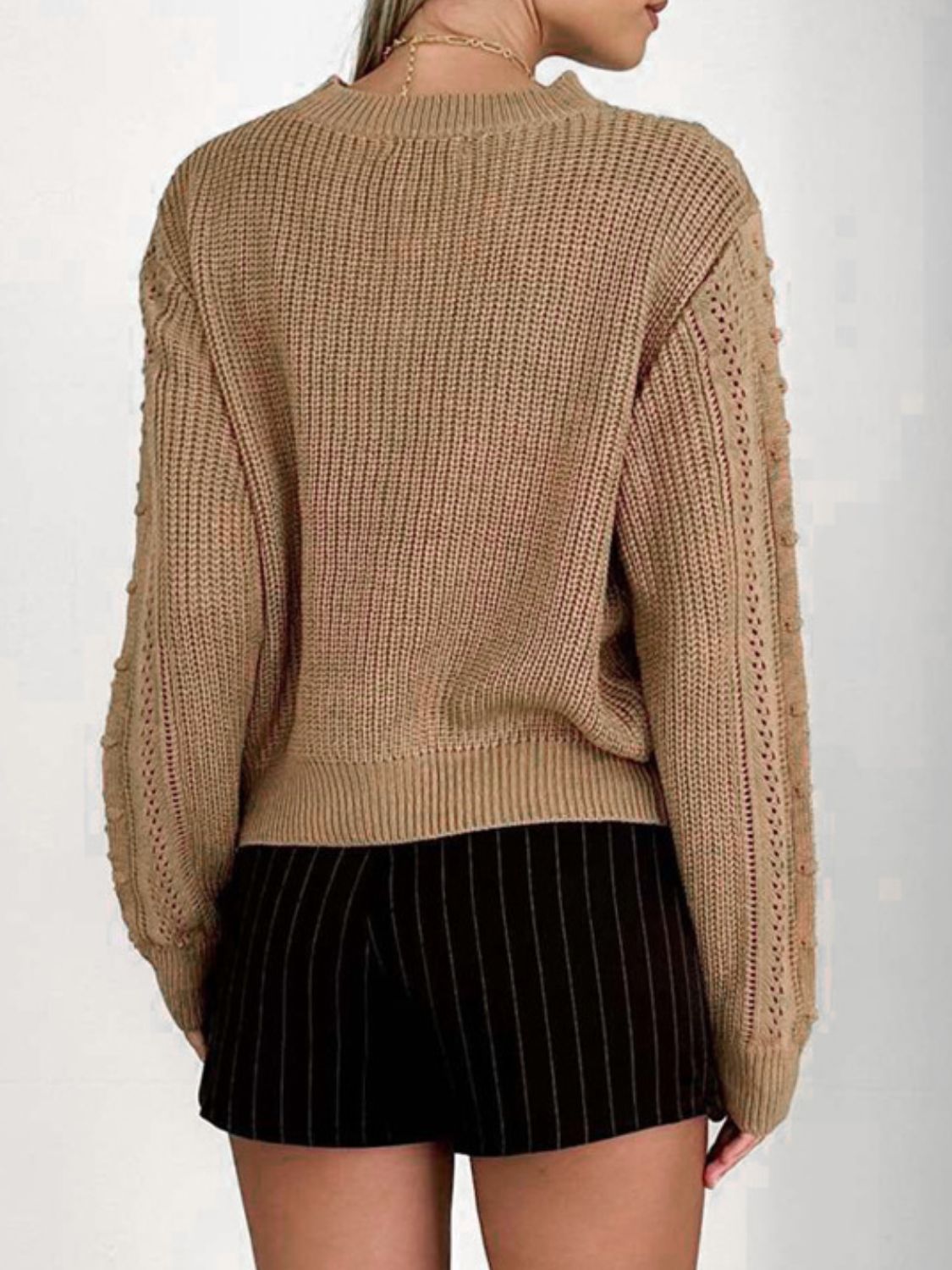 Camel textured chevron knit pullover sweater with bobble detail on sleeves.