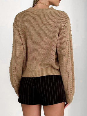 Camel textured chevron knit pullover sweater with bobble detail on sleeves.