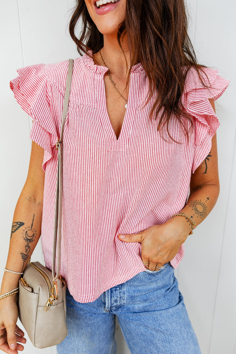 Red and white striped cotton blouse with ruffled short sleeves and a V-neck.