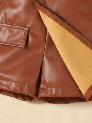 Brown faux leather baby shorts with pocket detail and soft lining.