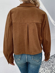 Textured corduroy cropped shirt jacket in camel with button cuffs and a back pleat detail.