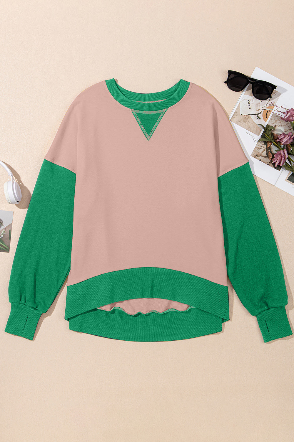 Chic Contrast Crewneck Sweatshirt in pink with green sleeves and trim, featuring a V-stitch detail.
