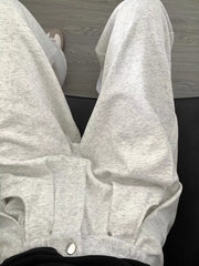 Men's gray heather wide-leg sweatpants with adjustable drawstring and pockets.