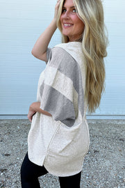 Colorblock waffle knit henley top in gray and cream with short sleeves and a relaxed fit.
