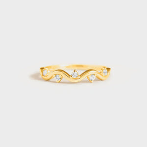 Gold wavelet ring with small clear stones