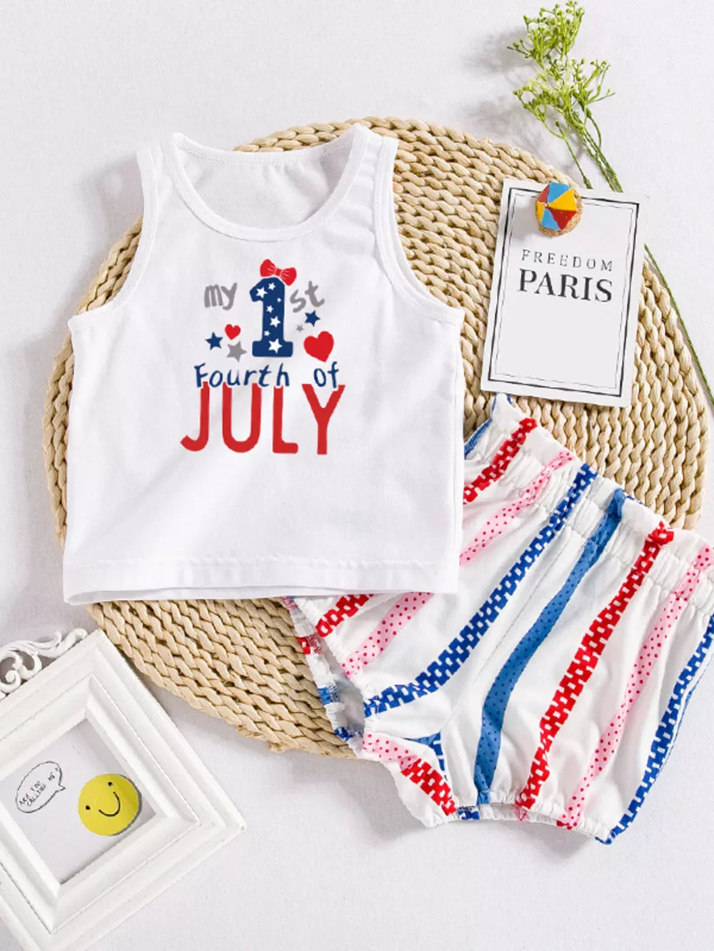White USA floral graphic baby set with striped shorts.