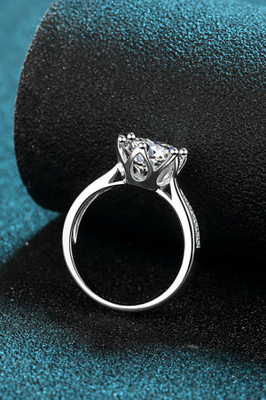 Silver ring with crown-set moissanite and pavé band