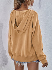 Tan boxy hooded sweatshirt with split hem and soft lining.
