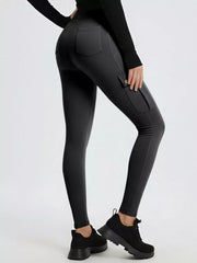 Gray maternity active pants with cargo pockets and a high waist.