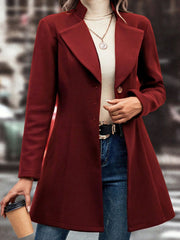 Burgundy wool blend coat with flared hemline, button front, and notched lapels.