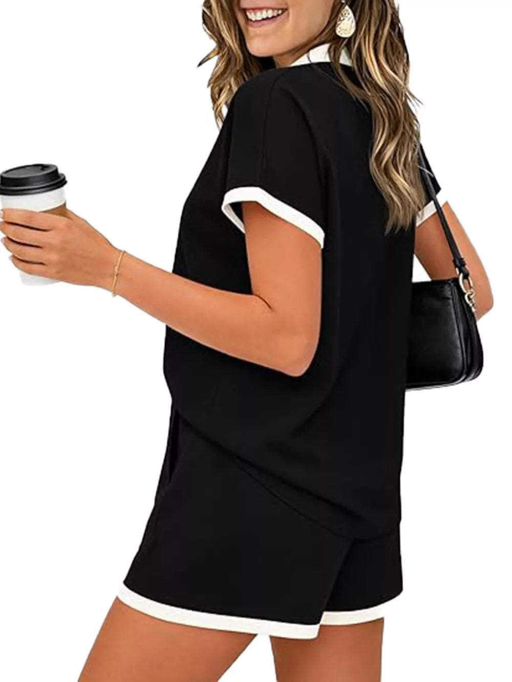 Black polo collar two-piece set with white trim on sleeves and shorts.