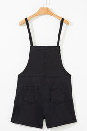 Black denim romper with adjustable straps and two back pockets.