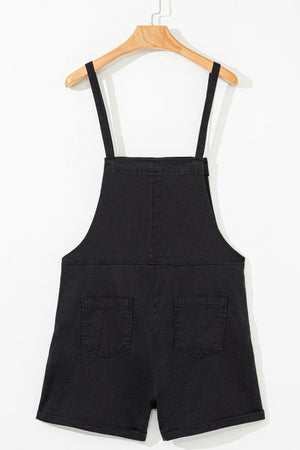 Black denim romper with adjustable straps and two back pockets.