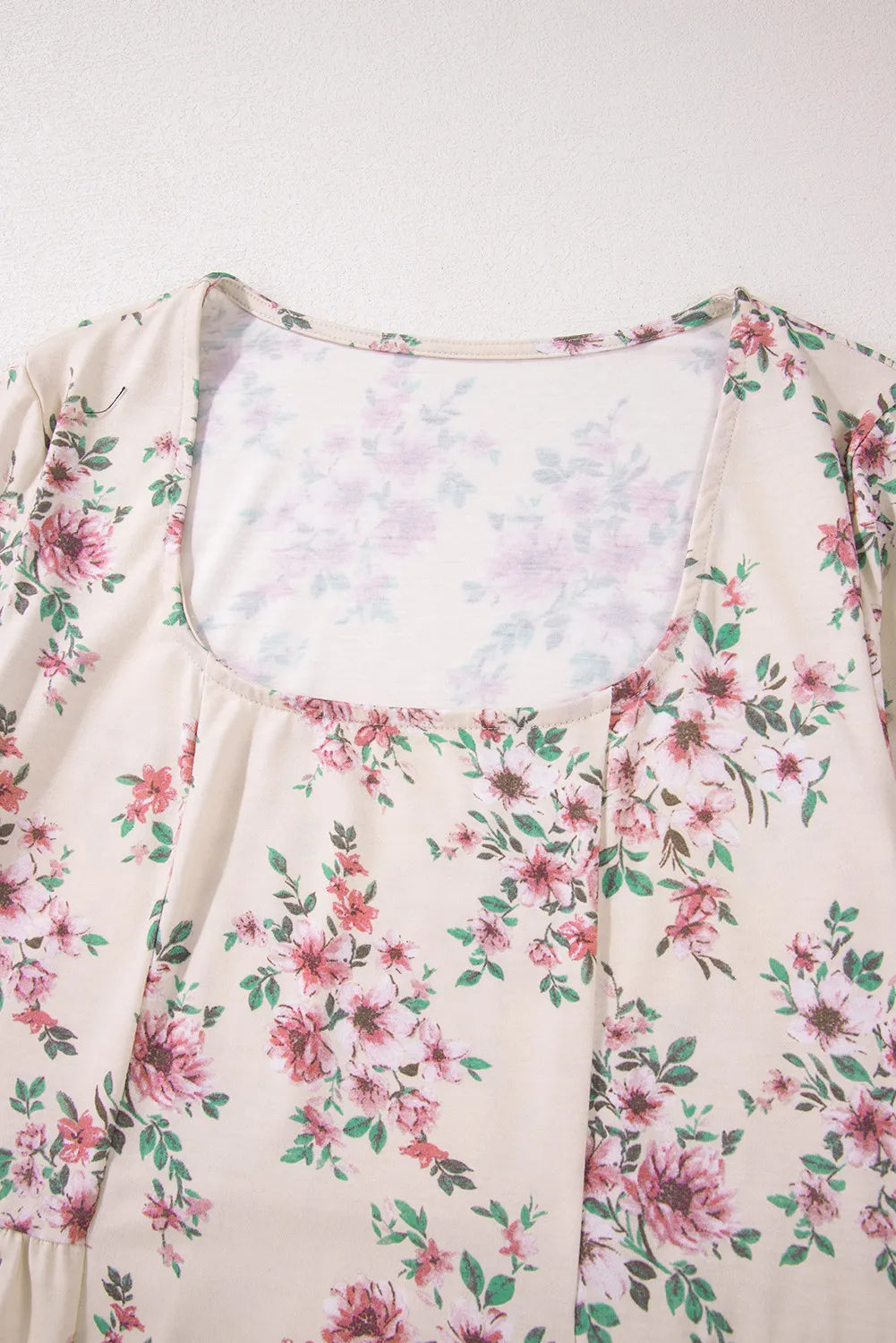 Floral print peplum blouse with square neck and ruffled hem