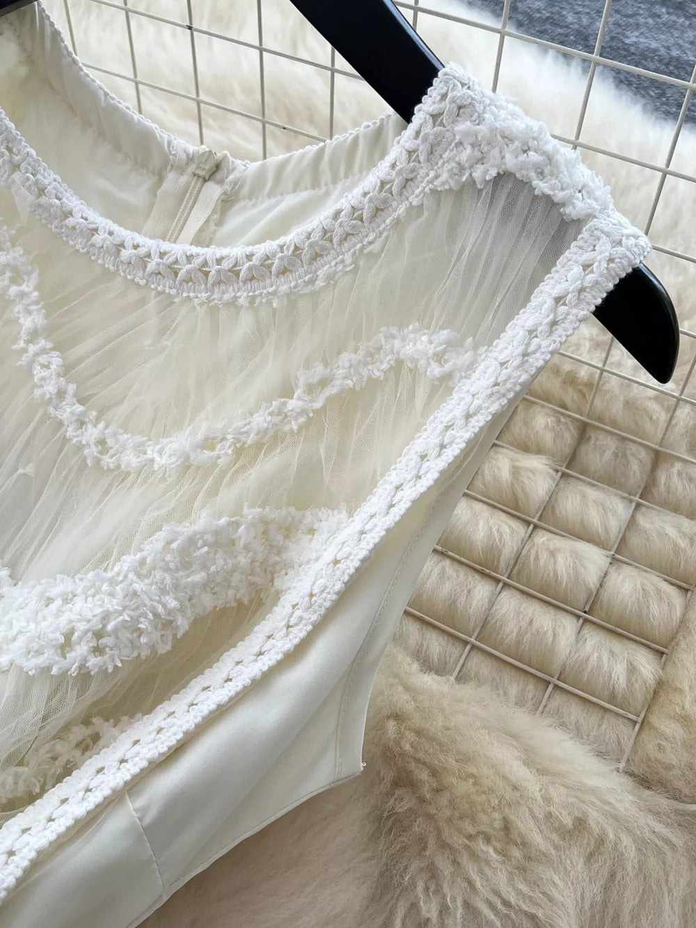 White tiered lace midi maternity dress with crochet trim and bow detail.