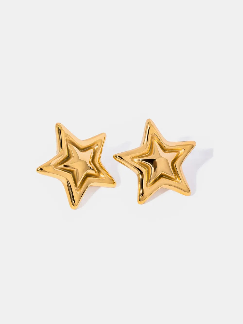 Gold starburst stud earrings with sculpted detail