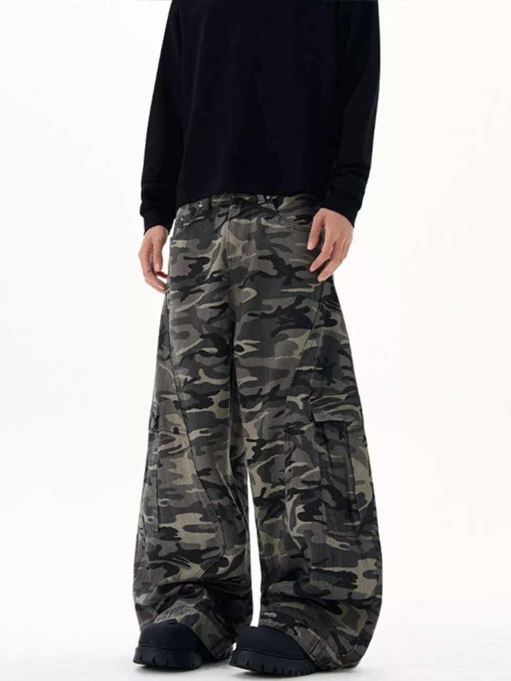Oversized camouflage cargo sweatpants with multiple pockets and a relaxed fit.
