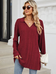 Burgundy ribbed knit collared tunic top with long sleeves and a slit hem.