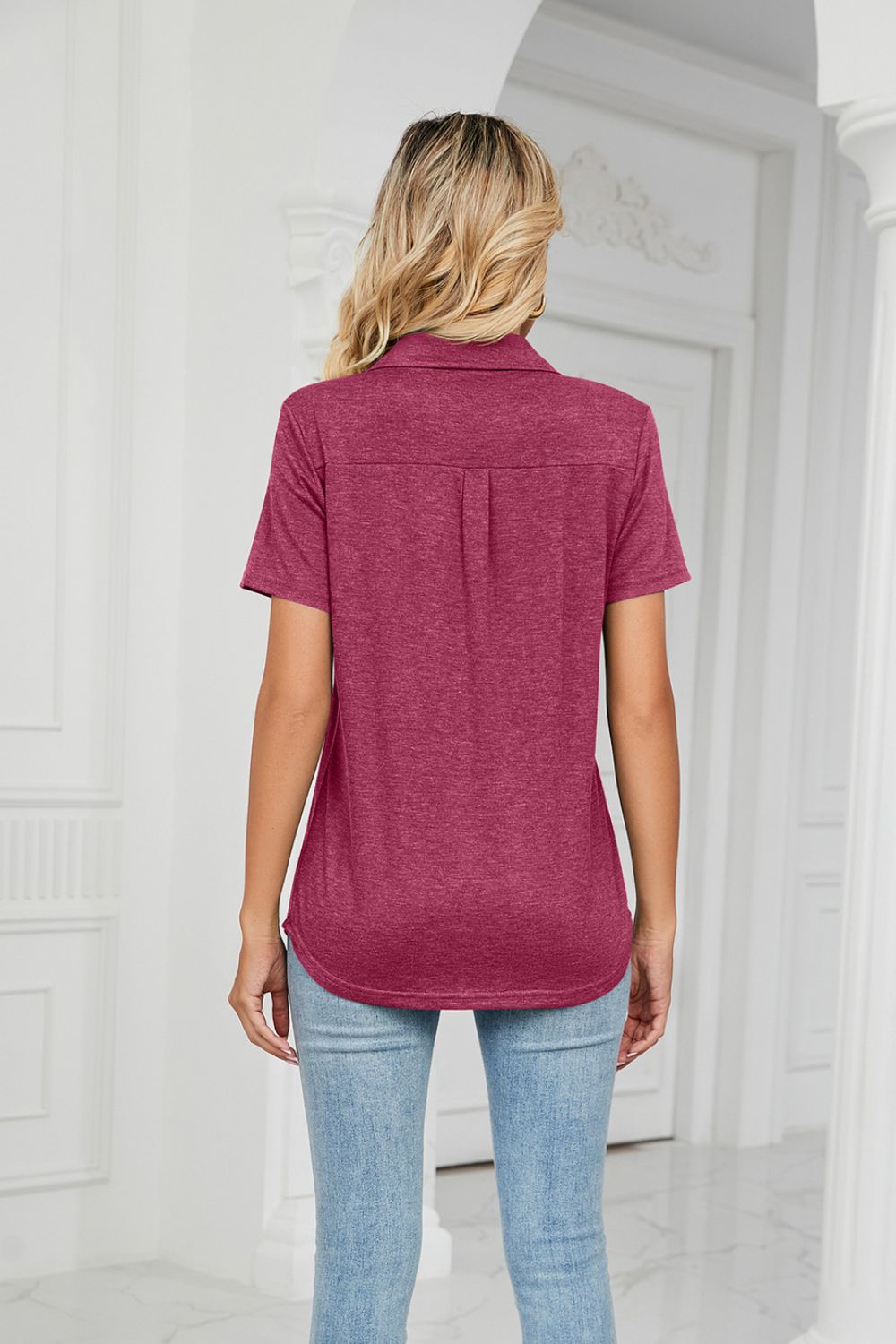 Deep Rose V-neck polo shirt with short sleeves and a subtle back pleat detail.