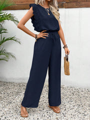 Dark blue textured ruffle sleeve drawstring jumpsuit with wide legs