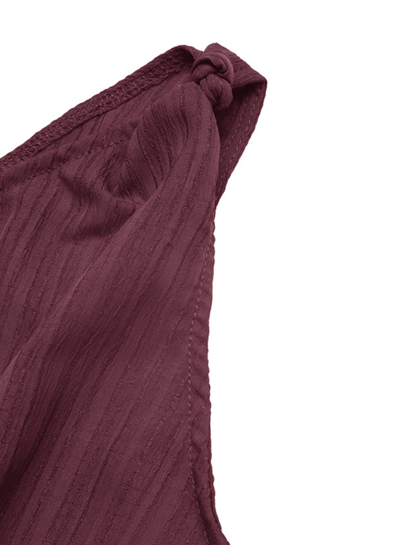 Burgundy one-shoulder romper with textured fabric and knot detail.