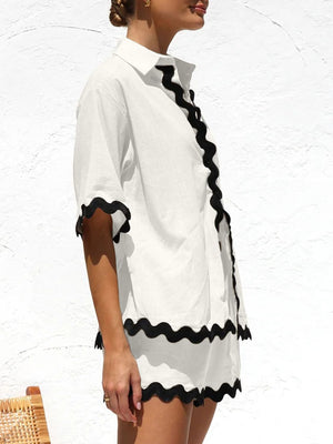 White linen co-ord set with black scalloped trim on shirt and shorts