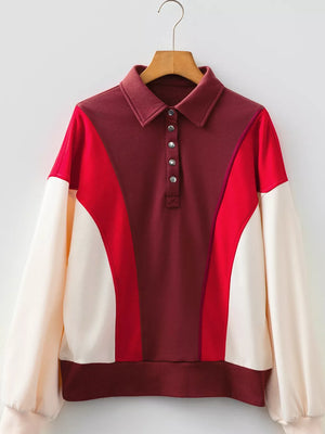 Color block cotton sweatshirt with buttoned collar and red, maroon, and cream panels.